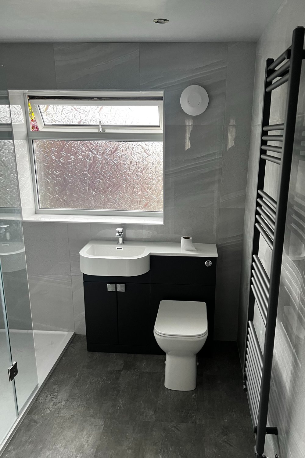 black bathroom with white accents